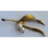 A good quality Hermes brooch in the form of a flow