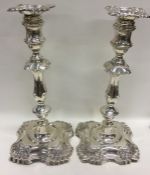 A pair of massive silver Adams' style candlesticks w