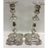 A pair of massive silver Adams' style candlesticks w