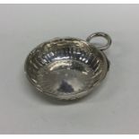 An 18th Century silver wine taster with serpent ha
