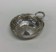 An 18th Century silver wine taster with serpent ha