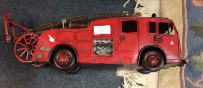 A tin plate model of a fire engine.