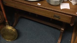 A mahogany single drawer desk.