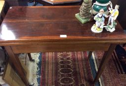 A mahogany hinged top table.