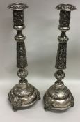 A pair of tall Russian tapering floral silver cand