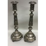 A pair of tall Russian tapering floral silver cand