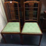 A pair of satinwood inlaid bedroom chairs.