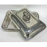 A silver plated entree dish.
