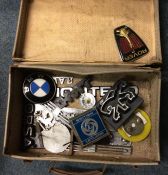 A collection of old car badges.