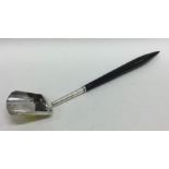 A large silver mounted caddy scoop with tapering h