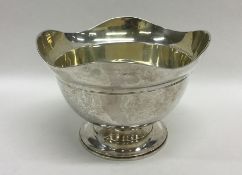 A heavy Russian silver sugar bowl with wavy edge,