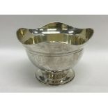 A heavy Russian silver sugar bowl with wavy edge,