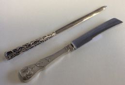 A silver knife together with one other. Est. £20 -
