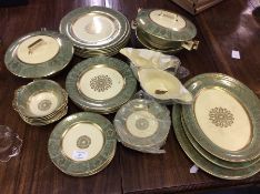 A decorative large gilded dinner service.