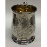 NEWCASTLE: A Georgian baluster shaped silver mug on sweeping