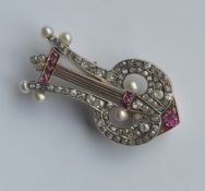 A French pearl, ruby and diamond brooch in the for