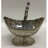 A Georgian silver swing handled basket decorated w