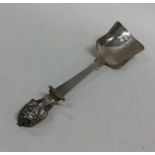 An unusual Victorian silver caddy spoon decorated