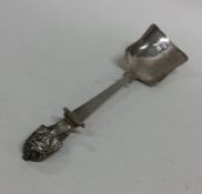 An unusual Victorian silver caddy spoon decorated