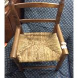 A small child's cane seated chair.