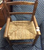 A small child's cane seated chair.