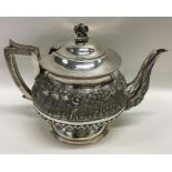 A heavy Indian silver teapot, the body attractivel