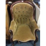 A button back scroll decorated armchair.