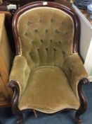 A button back scroll decorated armchair.