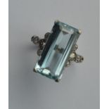 A diamond and aquamarine cocktail ring mounted in