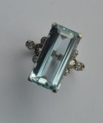 A diamond and aquamarine cocktail ring mounted in