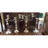 Plated candlesticks and candelabra.