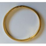 A 9 carat slave bangle. Approx. 7 grams.