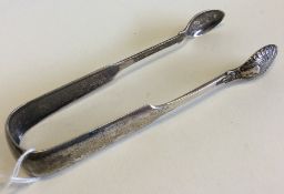 A pair of heavy fiddle pattern sugar tongs with sc