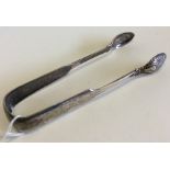 A pair of heavy fiddle pattern sugar tongs with sc