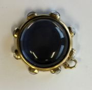 A massive circular crystal locket pendant with loo