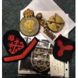 A group of old Naval badges, cap badges etc.