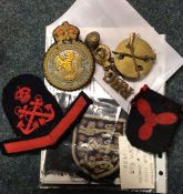 A group of old Naval badges, cap badges etc.