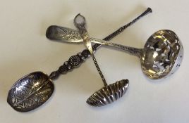 An Edwardian silver sifter spoon together with two