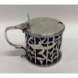 An attractive Victorian silver mustard decorated w