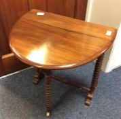 A small mahogany Sutherland table.