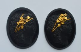 A pair of oval jet cameos of ladies' heads. Approx.