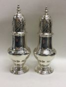 A rare pair of George II sugar casters, the top at