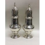 A rare pair of George II sugar casters, the top at