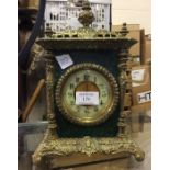 A brass mounted mantle clock.