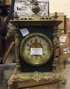 A brass mounted mantle clock.