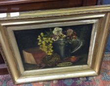 A framed oil painting of a still life.