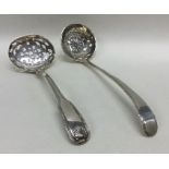 Two silver sifter spoons. Approx. 77 grams. Est. £