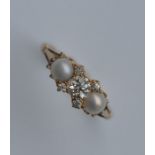 A pearl and diamond half hoop ring in 18 carat set