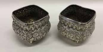 A pair of rectangular embossed heavy silver Indian