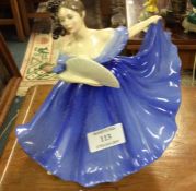 A Royal Doulton figure of a lady.